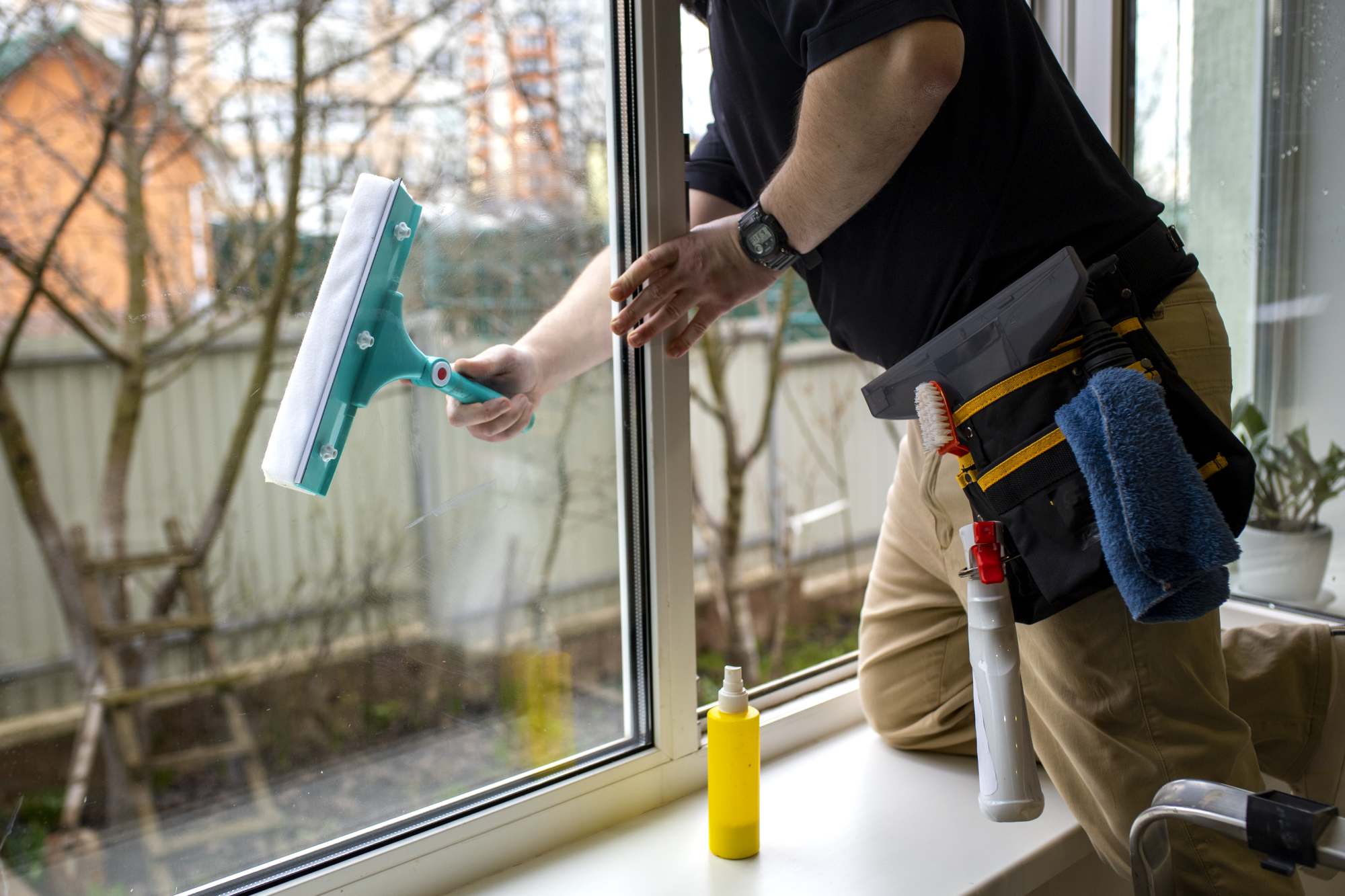 Squeegee window cleaning on a Brisbane home